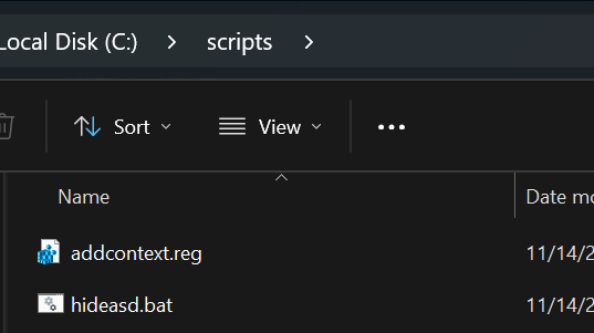 The c:\scripts folder containing two files, addcontext.reg and hideasd.bat